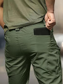 Calça cargo masculina tática de tecido ripstop em poliéster com múltiplos bolsos com zíper na lateral e coxa, corte reto e passante largo para cinto tático, disponível em várias opções de tamanho do P ao EGG, ideal para uso urbano e ao ar livre.