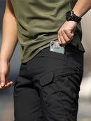 Calça cargo masculina tática de tecido ripstop em poliéster com múltiplos bolsos com zíper na lateral e coxa, corte reto e passante largo para cinto tático, disponível em várias opções de tamanho do P ao EGG, ideal para uso urbano e ao ar livre.