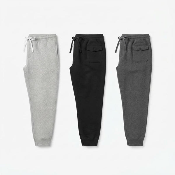 Calça de moletom masculina jogger em três cores: cinza mescla, preto e chumbo, vista lateral lado a lado