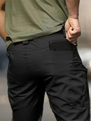 Calça cargo masculina tática de tecido ripstop em poliéster com múltiplos bolsos com zíper na lateral e coxa, corte reto e passante largo para cinto tático, disponível em várias opções de tamanho do P ao EGG, ideal para uso urbano e ao ar livre.